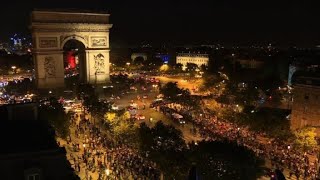 Algerians celebrate team's win on the Champs Elysées | AFP