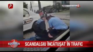 SCANDALAGIU INCATUSAT IN TRAFIC