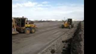 cat 12m grader and 12h grader trimming subgrade