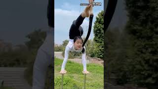 This amazing archer performs hand stand and hit the bullseye using her feet!