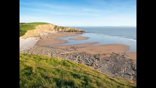 DUNRAVEN BAY BEACH AND CASTLE RUINS WALES UK