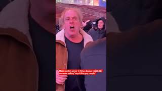 Mass Muslim prayer in Times Square heckled by someone yelling "stop killing gay people"