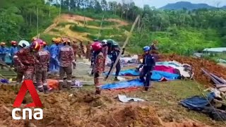 At least 21 dead, 12 missing following Malaysia landslide