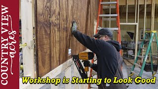 We Started to Coverup the Workshop Walls.  Sanding and Staining wood siding for a Rustic Look.