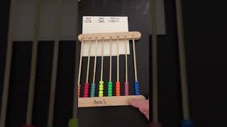 Adding on a base 5 abacus
