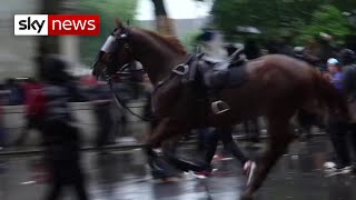 Officer knocked off horse during clash with BLM protesters in London