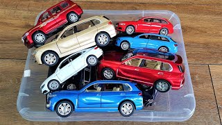 Box of diecast car models: Bmw x7, Audi RS8, VW Passat show