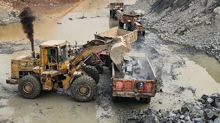 Monster Wheel Loader is Roaring: Caterpillar 966D Loading Big Rocks into Big Trolleys