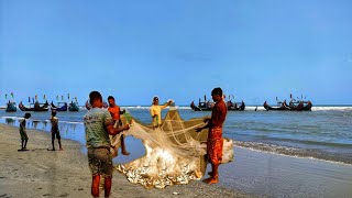 উত্তাল সাগরে টানা জাল দিয়ে মাছ ধরা Fishing with trawl nets in rough seas