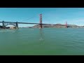 heavy water stand up paddling under the golden gate bridge