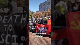 Antifa hold a banner featuring the faces of Stalin, Mao \u0026 other 20th-century communist dictators