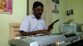 Samuel john is singing AMALA DHAYABARA