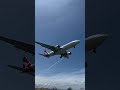 qantas a330 200 landing at a windy sydney airport