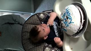 Jaedyn ripping into first birthday cake