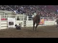 justin berg ninja kicks the fence on his dismount at the 2013 calgary roughstock rumble