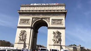 Protesters raise banners on Paris' Arc de Triomphe