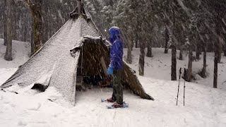 Camping Solo During Heavy Snowfall in a Winter Forest