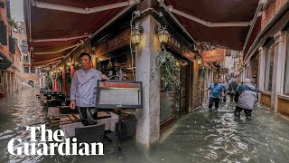 Extraordinary scenes in Venice as city tries to function under deluge