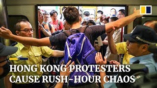 Protesters block subway trains, causing massive delays during Hong Kong rush hour