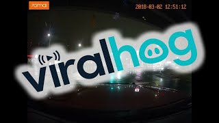 Red Light Runner Nearly Causes Accident on Wet Roads || ViralHog