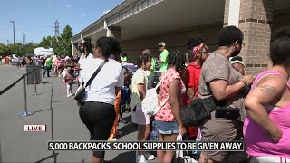 Crowd turns out in Louisville for the 'The Hammer's Great Backpack Giveaway' for school supplies