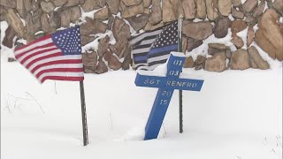 Cross In Snow Is Reminder Of Dangerous Driving Conditions On Highway 285