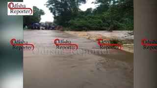 Flood water flows on  a Bridge near MV-37 in Malkangiri