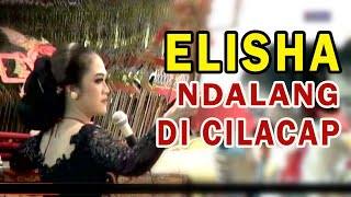 PEREMPUAN / BUKAN ORANG JAWA, ELISHA ORCARUS ALASSO LIHAI MEMAINKAN WAYANG KULIT