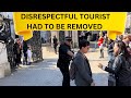 DISRESPECTFUL TOURIST IGNORED THE ARMED  OFFICER HAD TO BE REMOVED