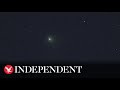 Watch again: Green comet flies by Earth