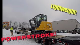 Winter time heavy equipment hauling with 40ft flatbed.