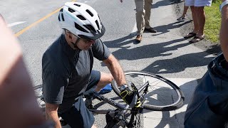 President Joe Biden falls off bike