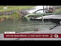 Water main break closes busy road