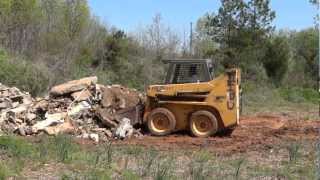 Gehl 4835 SXT Skidsteer Moving Concrete Pile (HD)