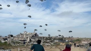 Palestinians rush for aid airdropped in the northern Gaza Strip | AFP