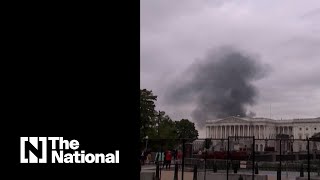 Smoke appears to billow from US Capitol