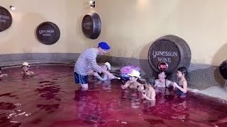 Japanese enjoy wine bath to celebrate Beaujolais Nouveau