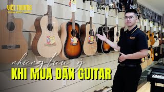 Những lưu ý khi mua đàn guitar thùng