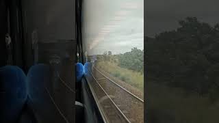 Melbourne-bound XPT passing hirail vehicle.