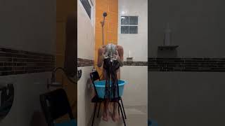 Washing my long hair using drinking water because the quality of water is not good for my long hair.