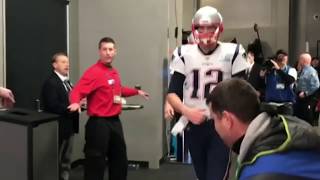 Tom Brady greets Randy Moss heading onto the field at Super Bowl LII | Feb 4, 2018
