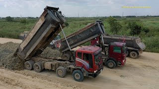 Hyundai dump truck unloading dirt ឡានយីឌុបចាក់ដីធ្វើផ្លូវ