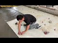 professional living room floor construction worker using large size ceramic tiles 120 x120cm