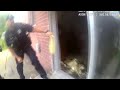 Bodycam video shows Westland police pull woman from burning home