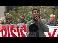 climate activists protest outside court as exxon mobil goes on trial afp