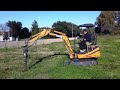 case cx 18 series ii miniexcavator with auger with a 15 cm diameter screw.mov