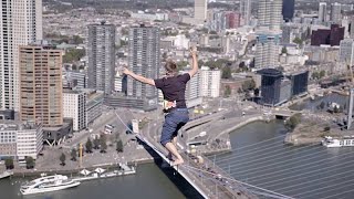 Slackliner Jaan Roose completes 625 m river crossing between highest buildings in Rotterdam