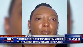 Woman accused of beating elderly mom with hammer turns herself in