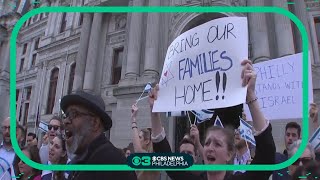 People gather at City Hall to show solidarity with the Jewish community and Israel