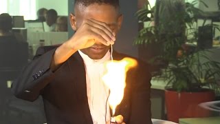 WATCH: How did this magician burn a playing card without us seeing?!